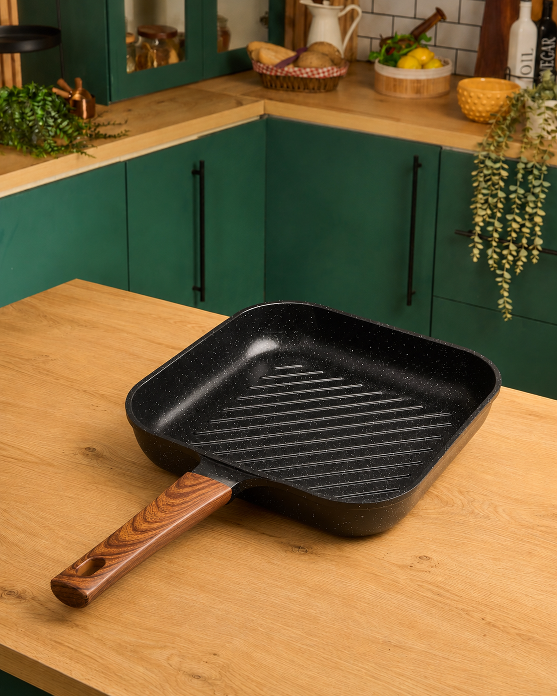Granova black non-stick grill pan 28 cm cooking grilled food in a modern kitchen