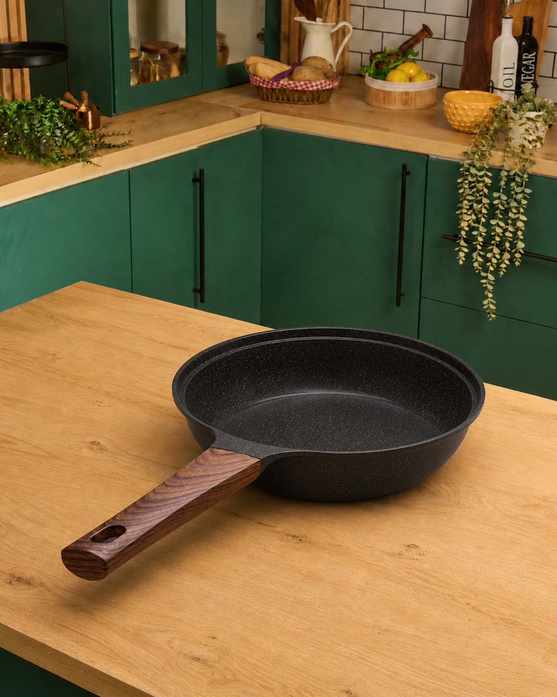 Granova black non-stick frying pan 24 cm cooking eggs in a modern kitchen