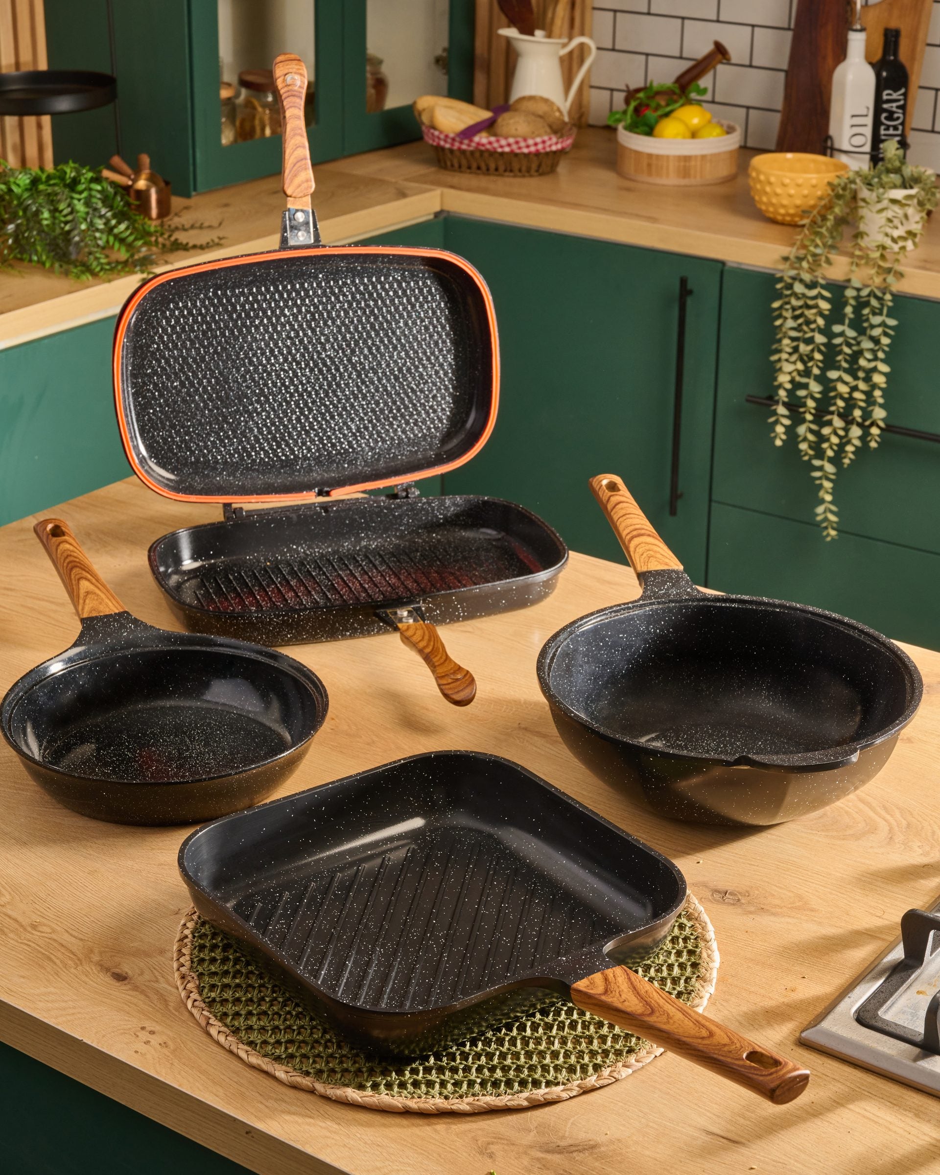 Granova Master Set in black with Double Grill 40 cm, Grill Pan 28 cm, Frying Pan 24 cm and Wok 28 cm displayed together