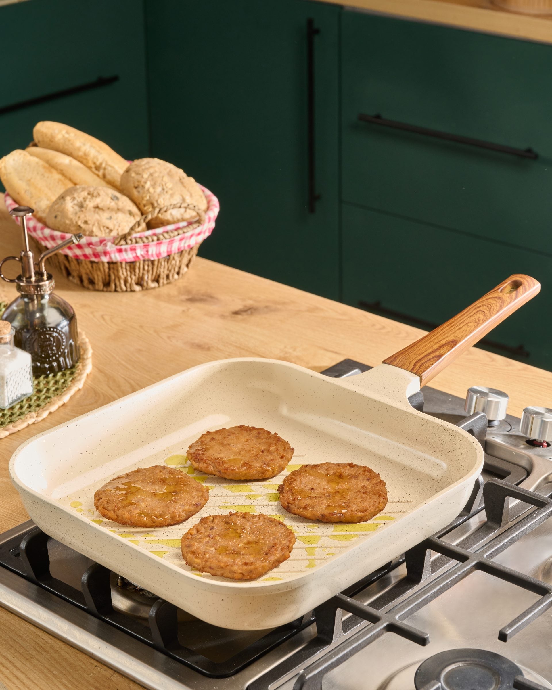 Granova cream Grill Pan 28 cm cooking burger patties on a stovetop